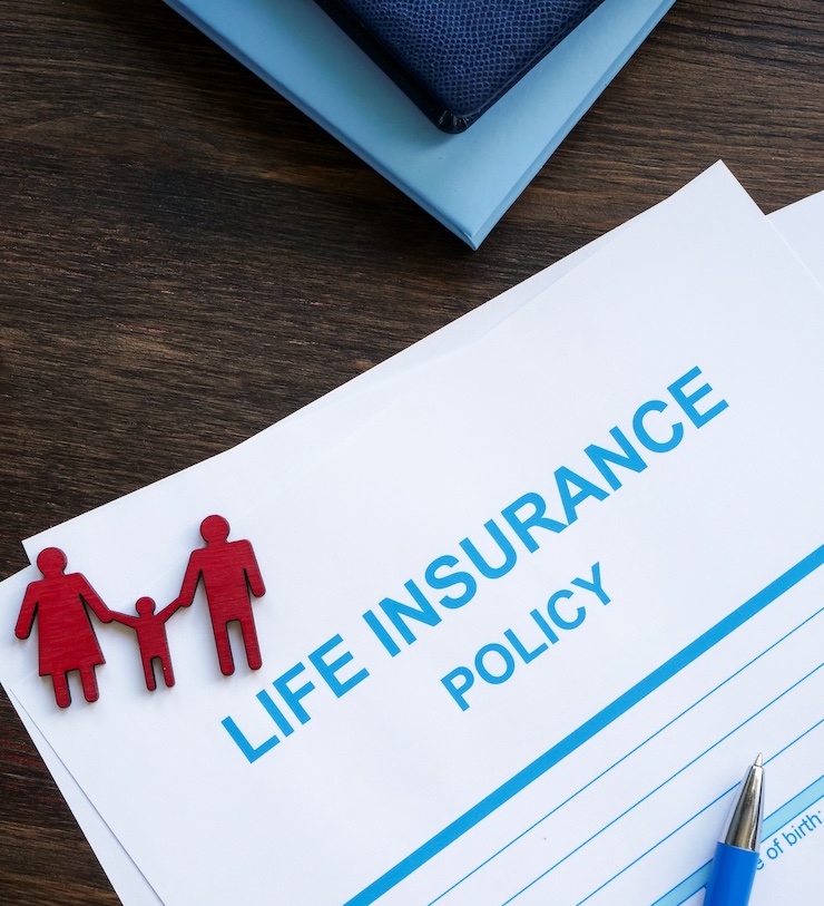 Life Insurance Policy And Figurines Of Family.